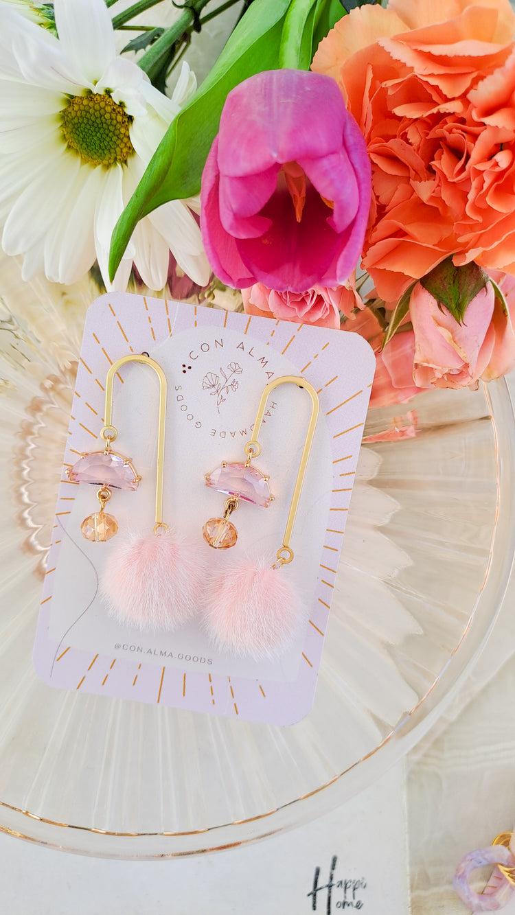 Asymmetrical pom pom dangles